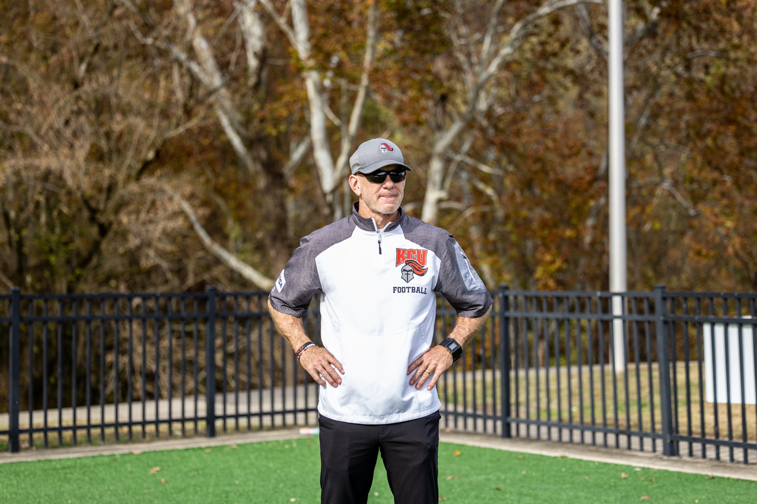 Coach Jason Aubry on the football field